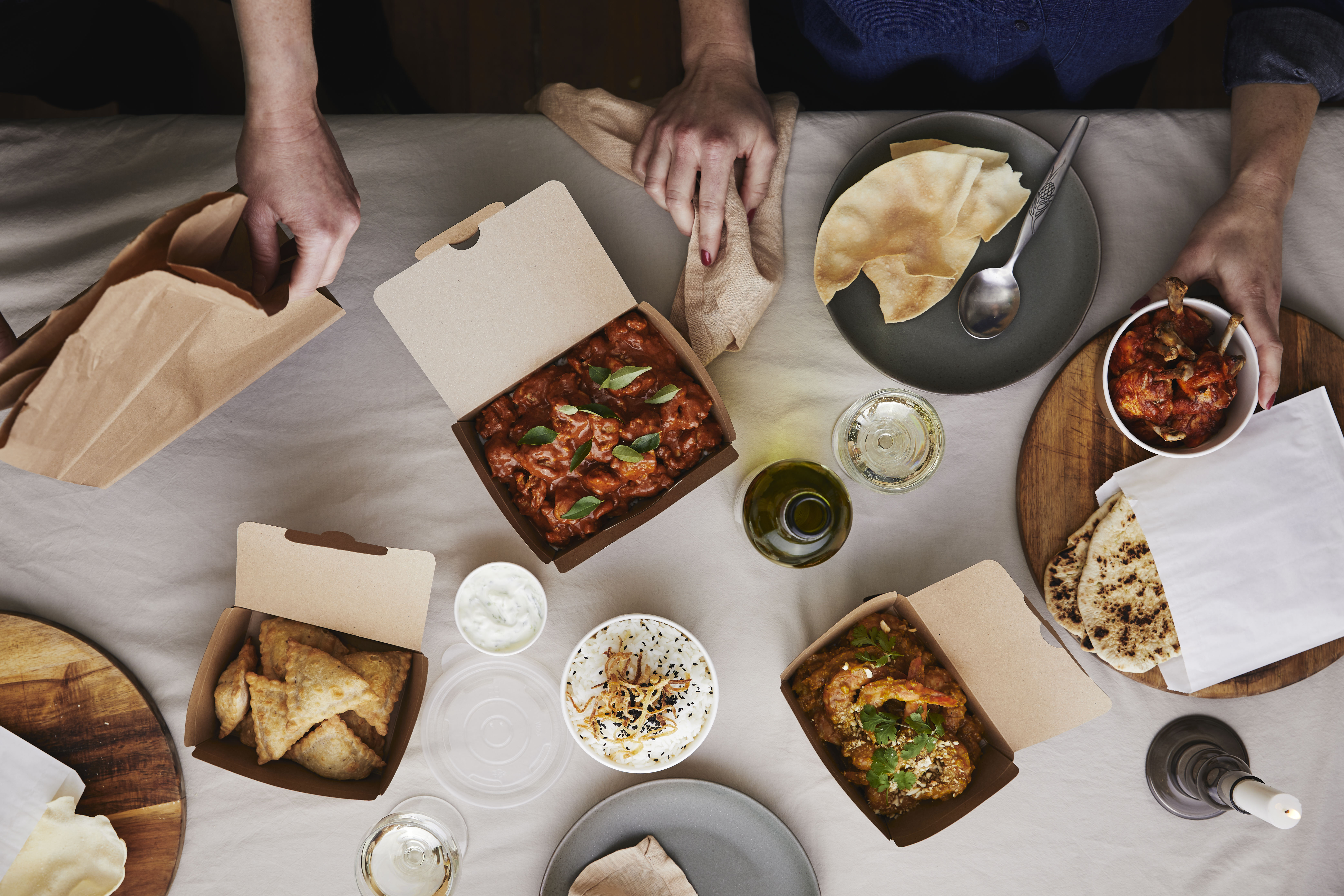 Takeaway food shared for dinner at home. 