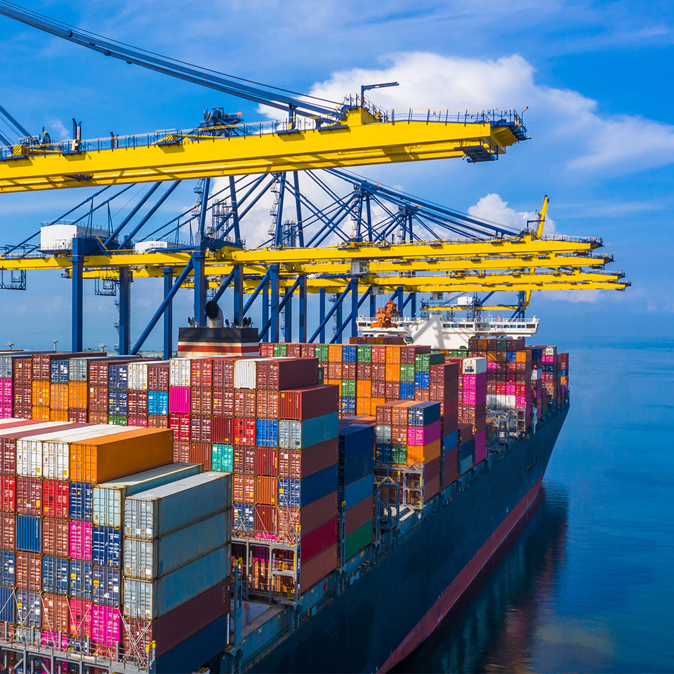 Image of freight being loaded onto a ship