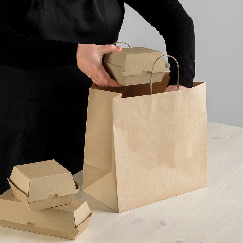 Food being lifted into a Detpak carry bag